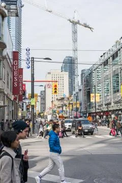 Pedestrians crossing a busy intersection Stock Photos