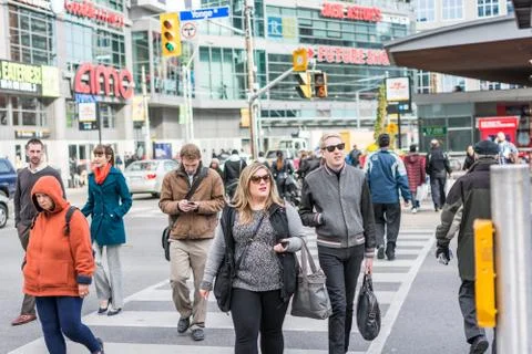Pedestrians crossing a busy intersection Stock Photos