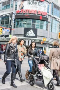 Pedestrians crossing a busy intersection Stock Photos