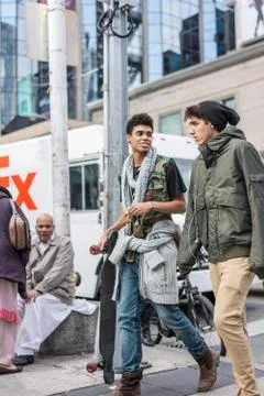 Pedestrians crossing a busy intersection Stock Photos