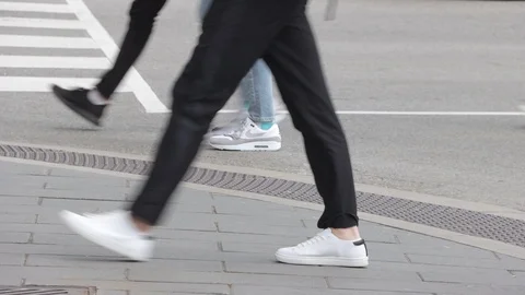 Pedestrians crossing at a  downtown intersection Stock Footage 119344367