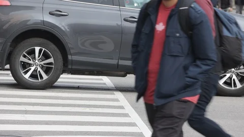 Pedestrians crossing at dowtown intersection Stock Footage 119344356