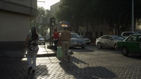 Pedestrians crossing street. Downtonw of Monterrey Mexico Stock Footage