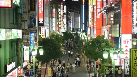 Pedestrians crossing the street at Shibuya crossing Stock Footage
