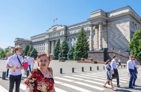 Pedestrians of different age on the square in front of the House of Soviets Stock Photos