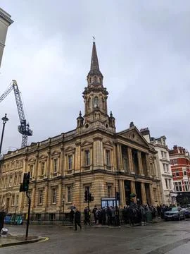 Pedestrians gather outside the classical facade of Hinde Street Methodist Church Stock Photos