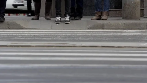 Pedestrians hurry to cross the intersection on zebra crossing Stock Footage 72269678