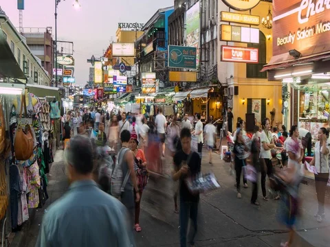 Pedestrians on Khao San Road at dusk, Bangkok, Thailand, South East Asia, Asia Stock Footage