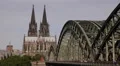 Pedestrians Passing Rush Hour Establishing Shot Famous Bridge Cologne Cityscape HD Footage
