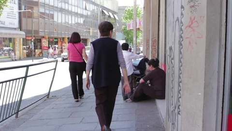 Pedestrians in street Stock Footage 77045633