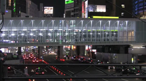 Pedestrians walking across an elevated walkway in Shibuya, Tokyo, editorial Stock Footage 39594232