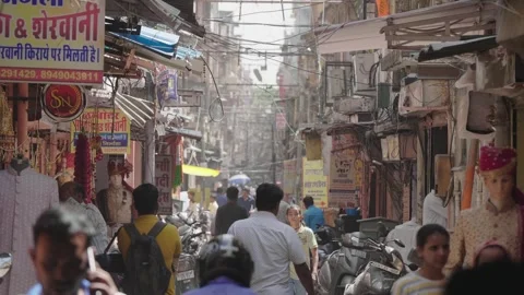 Pedestrians walking in busy narrow congested city street. Rajasthan, India Stock Footage 248758666