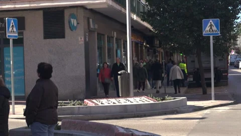 Pedestrians walking on city sidewalk in Madrid Video stock 329510053