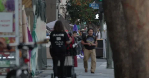 Pedestrians walking city siedwalk sof focus Stock Footage 138961410