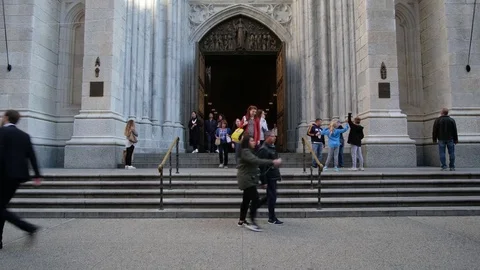 Pedestrians walking on front the Saint Patrick Church Stock Footage 81445451