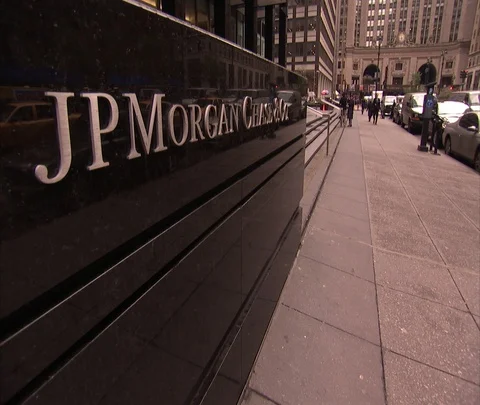 Pedestrians walking past front of JP Morgan Chase building in Manhattan Stock Footage 86749571