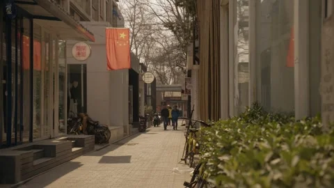 Pedestrians Walking Past Shops and Bicycles in Beijing 798 Art District Street Stock Footage 345688532