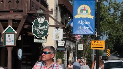 Pedestrians walking through small town Stock Footage 40218477