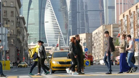 Pedestrians on zebra, people crossing road on crosswalk. Moscow city street. Stock Footage 156097853