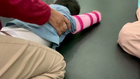 Pediatric Physical Therapy Session for Child with Motor Impairment Stock Footage 339566783