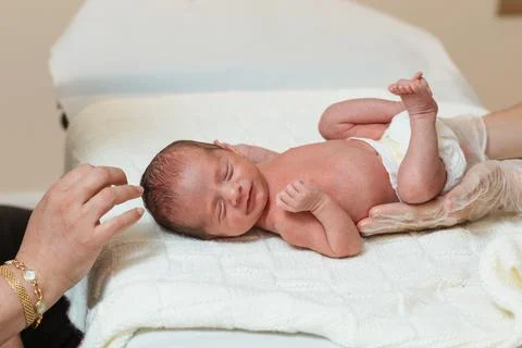 Pediatric physiotherapist performs an evaluation of the primary respiratory Stock Photos