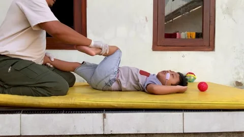 Pediatric Physiotherapy Session for Cerebral Palsy Rehabilitation Stock Footage 339394702