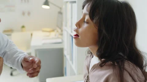 Pediatrician Checking Thyroid Glands of Little Girl Stock Footage 253559079