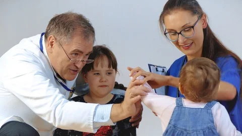 Pediatrician examining babies Stock Footage 104099886