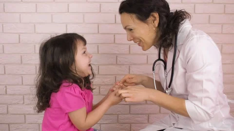 The pediatrician plays with the child. Stock Footage 85861669