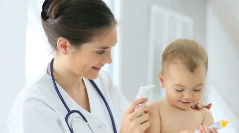 Pediatrician taking baby's temperature Stock Footage