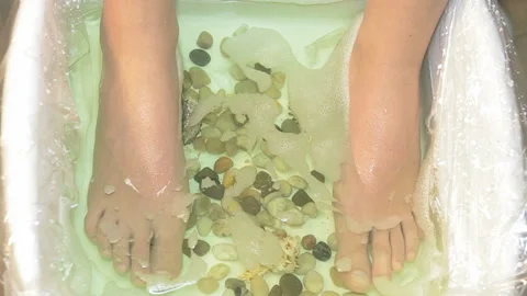 Pedicure, feet in the bath. Stock Footage 86530477