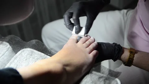 Pedicure Master Buffing Toenails with Nail Buffer Close Up Stock-Footage 341507203