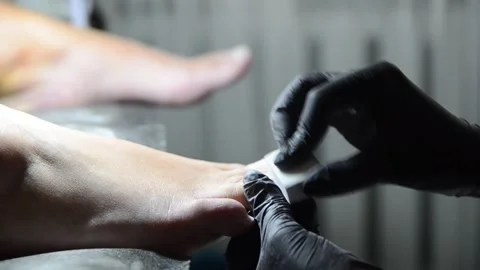 Pedicure Master Buffing Toenails with Nail Buffer Close Up Stock Footage 341507255