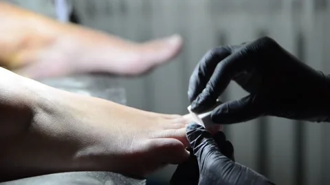 Pedicure Master Buffing Toenails with Nail Buffer Close Up Stock Footage 341507274