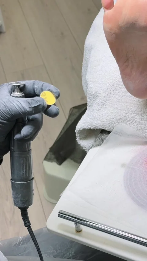Pedicure master changing disposable abrasive sticker on pododisc Stock Footage 328177243