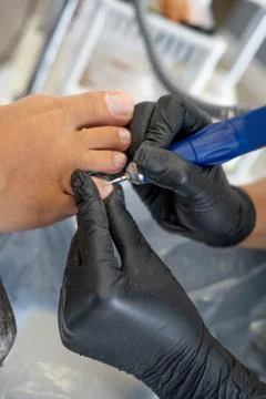 The pedicure master does a close-up pedicure Stock Photos