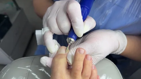 Pedicure master make hardware pedicure. Foot and nail care concept Stock Footage 333496859