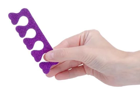 Pedicure separators in hand Stock Photos