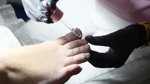 Pedicurist Applying Cuticle Care Solution with Dropper Close Up 스톡 동영상 342045085