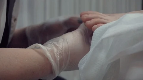 Pedicurist hands at work Stock Footage 87825326