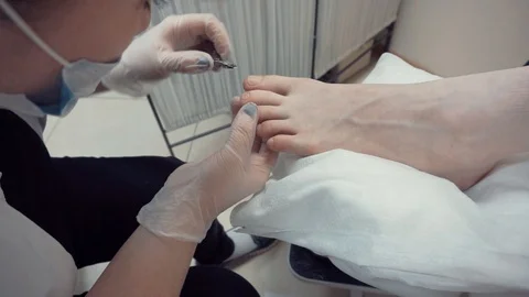 Pedicurist working with nipper Stock Footage 87825336