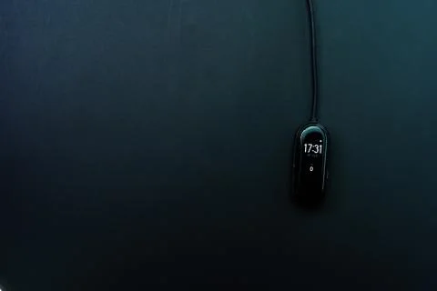 Pedometer, watch on a black background Stock Photos