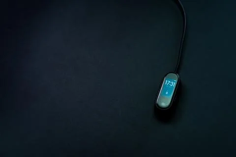 Pedometer, watch on a black background Stock Photos