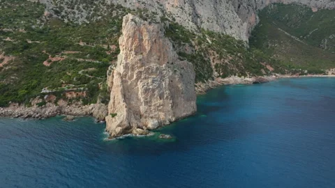 Pedra Longa Monolith Emerging from the Sardinian Sea Stock Footage 313292751