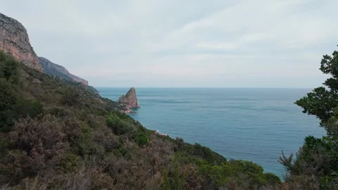 Pedra Longa Sea Stack and Coastal Cliffs Above the Mediterranean Stock Footage 339032497