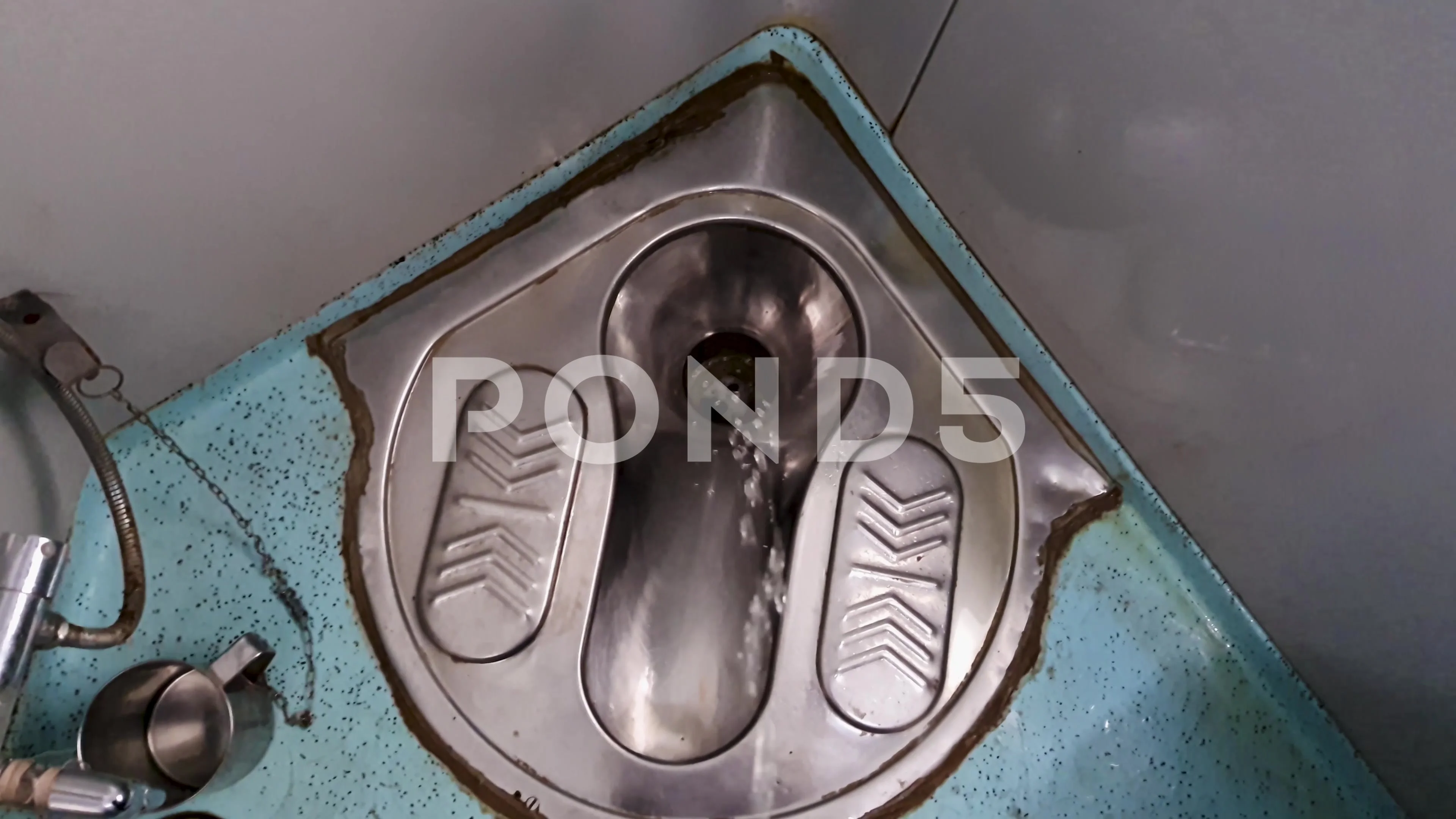 peeing at indian railway passenger train toilet from top angle