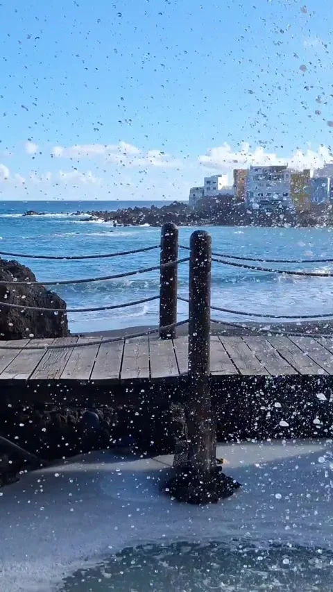 Peek-a-boo view of Punta Brava through the waterfall! Video stock 344559858