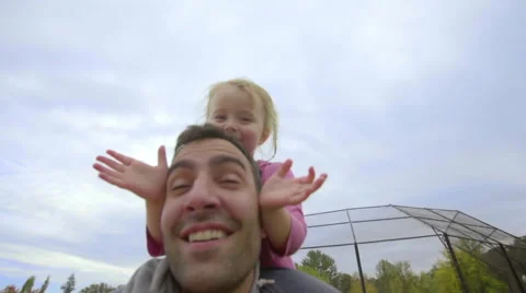 Peekaboo while on dads shoulders Stock Footage 58607438