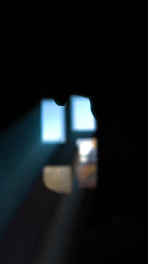 Peeking through a small gap between clasped hands to see a bright window wi.. Stock Footage 340490968