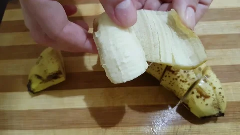 Peel the banana Stock Footage 134894376